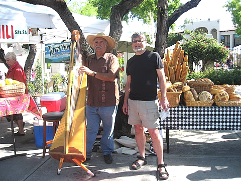 Francisco Gonzales with one his 7 Mexican harps, at the Sunday Farmer's Market